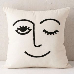 SOLD Urban Outfitters off white and black winky throw pillow